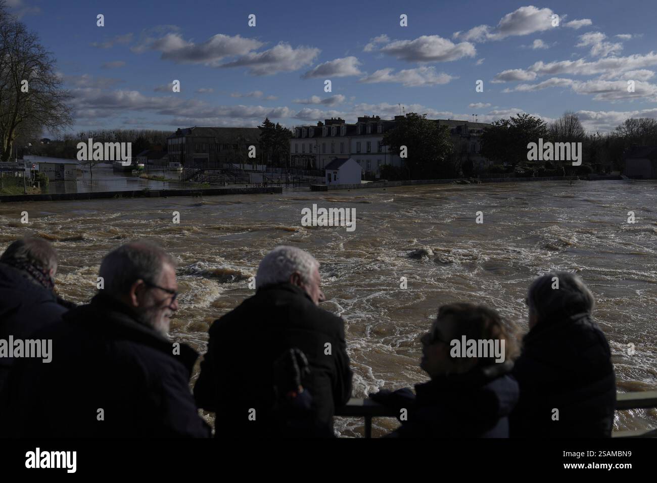 People look at the Vilaine river as severe flooding hits western France ...