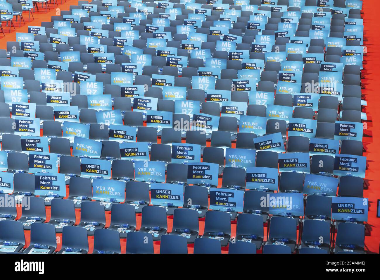 Assembly hall, deserted with many empty chairs and posters with the inscription UNSER KANNZLER. Bundestag election campaign of the CDU party for the p Stock Photo