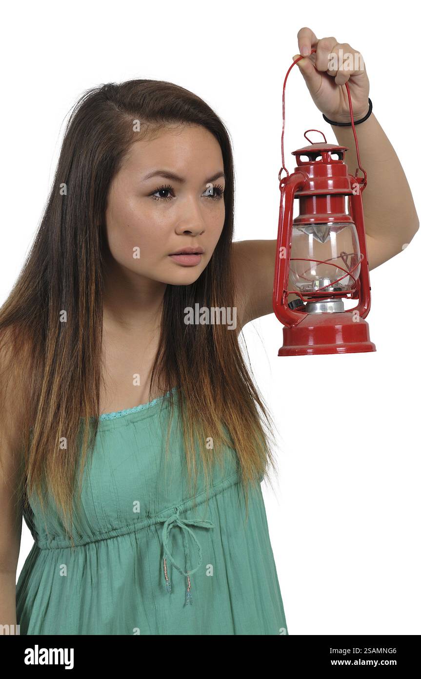 Woman looking with an old fashioned lantern Stock Photo - Alamy