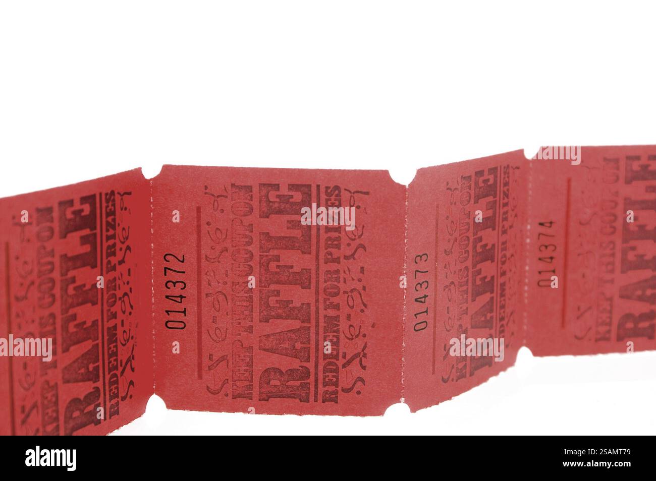 A strand of bright red rafflle tickets Stock Photo - Alamy