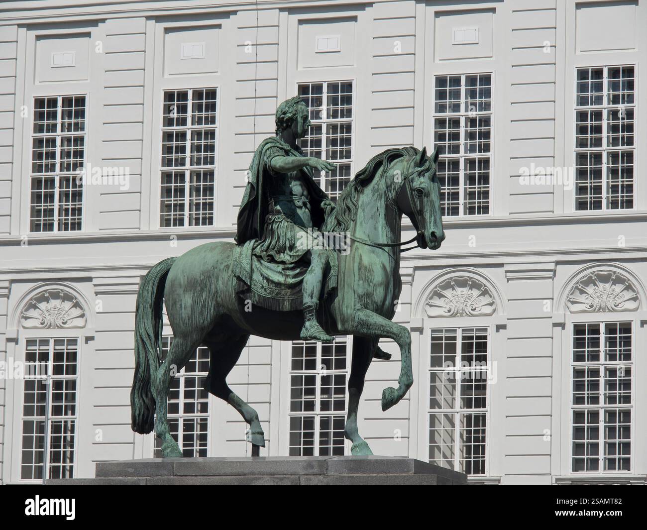 Statue of a horseman in front of a facade of a historic building with classical elements, Vienna, Austria, Europe Stock Photo