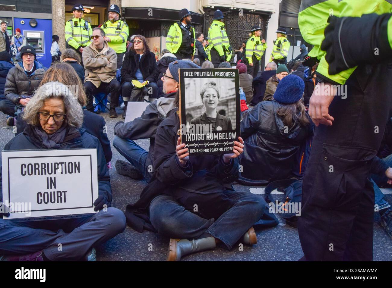 London, UK. 30th January 2025. A protester holds a picture of activist ...