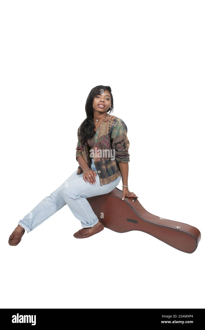 Beautiful young woman with an acoustic guitar Stock Photo - Alamy