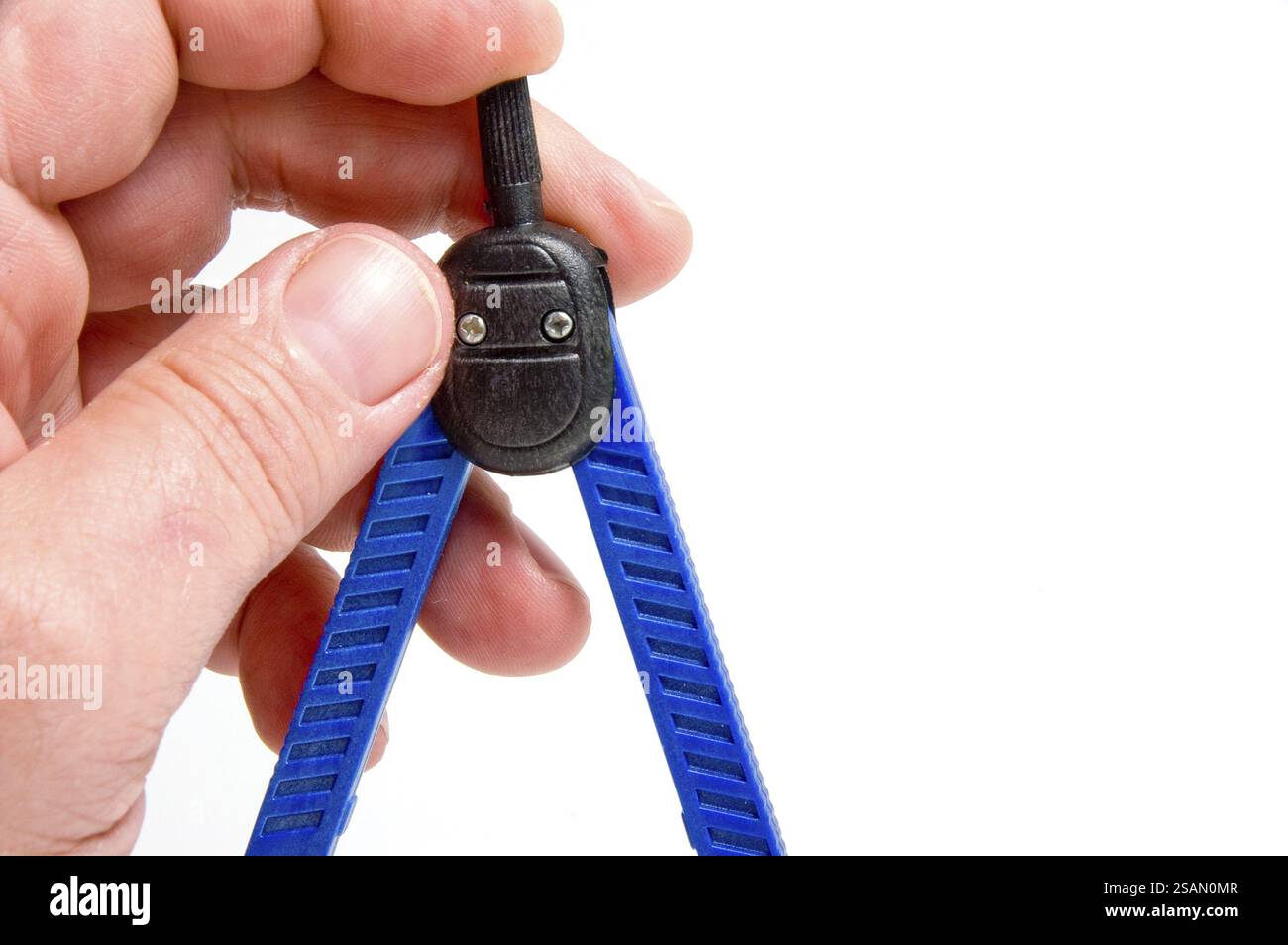 A compass being held by a student ready to go back to school Stock ...