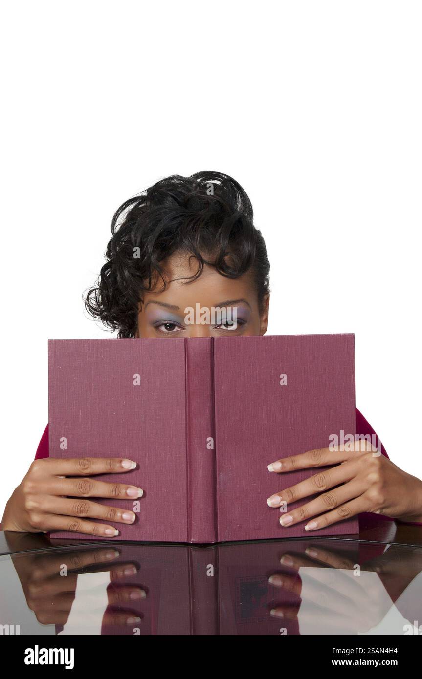 African woman reading a book hi-res stock photography and images - Alamy