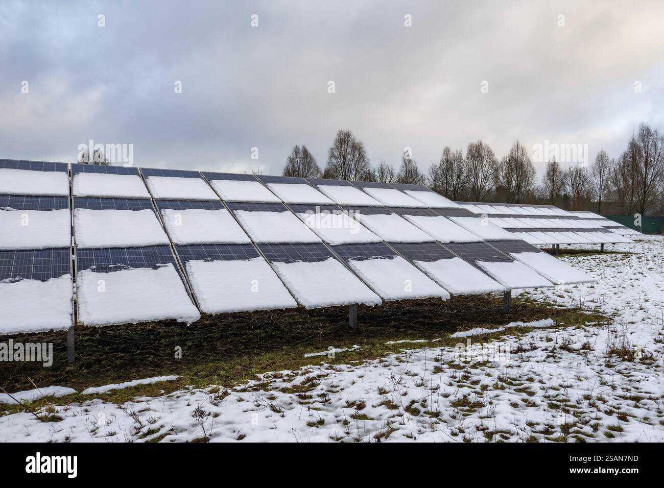 View of Solar panel farm covered with snow during winter, impacting energy ...