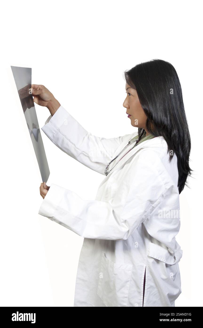 A beautiful female radiologist examining an x-ray Stock Photo - Alamy