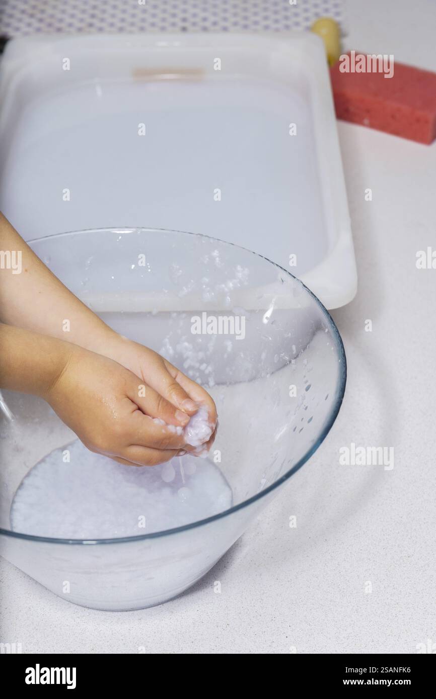Pulp Hand Image Close-up of a child's hands picking up recycled paper pulp Stock Photo ...