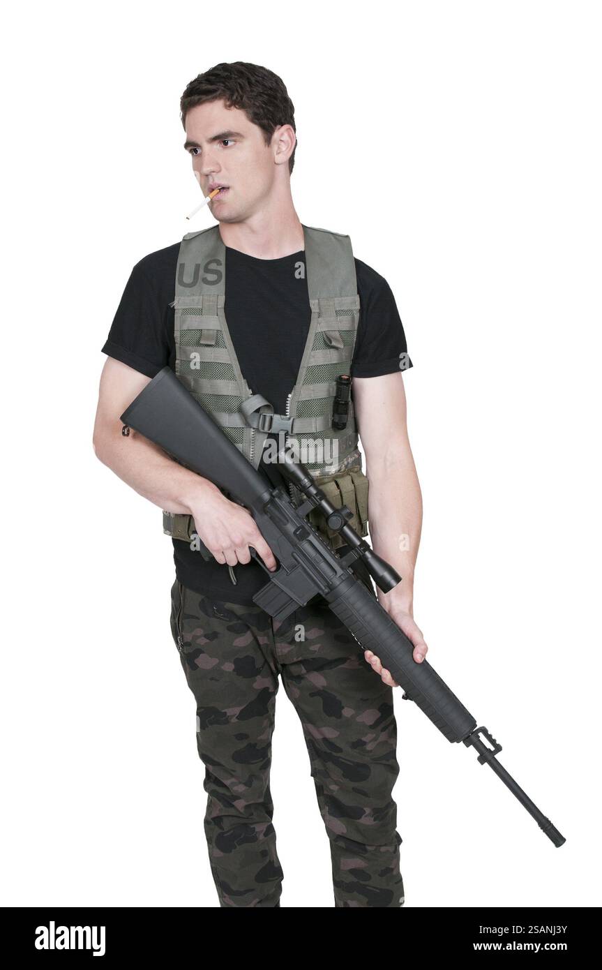 Handsome young man soldier with a rifle Stock Photo - Alamy