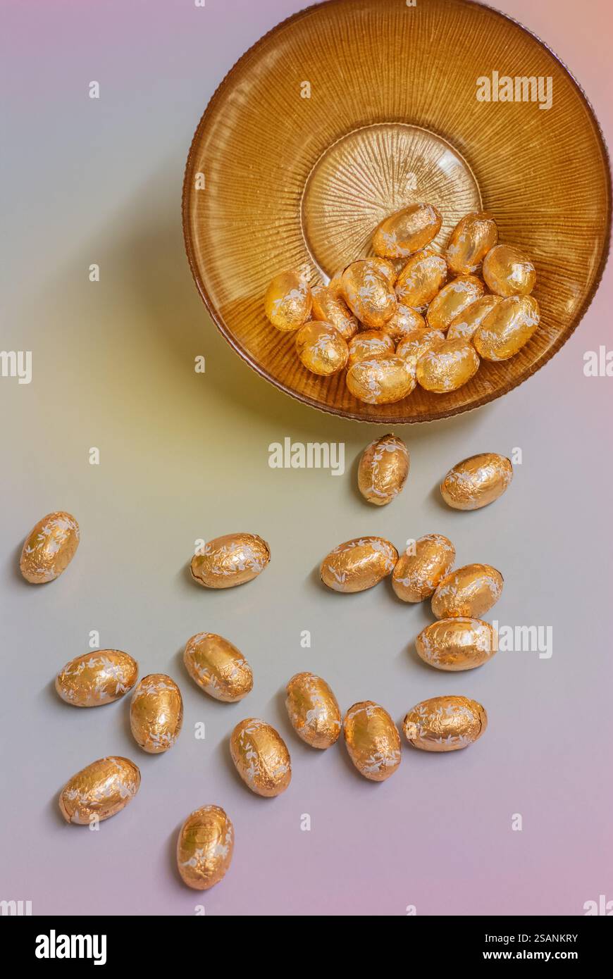 Gold foiled Easter eggs in a gold bowl; concept easter celebration. Stock Photo