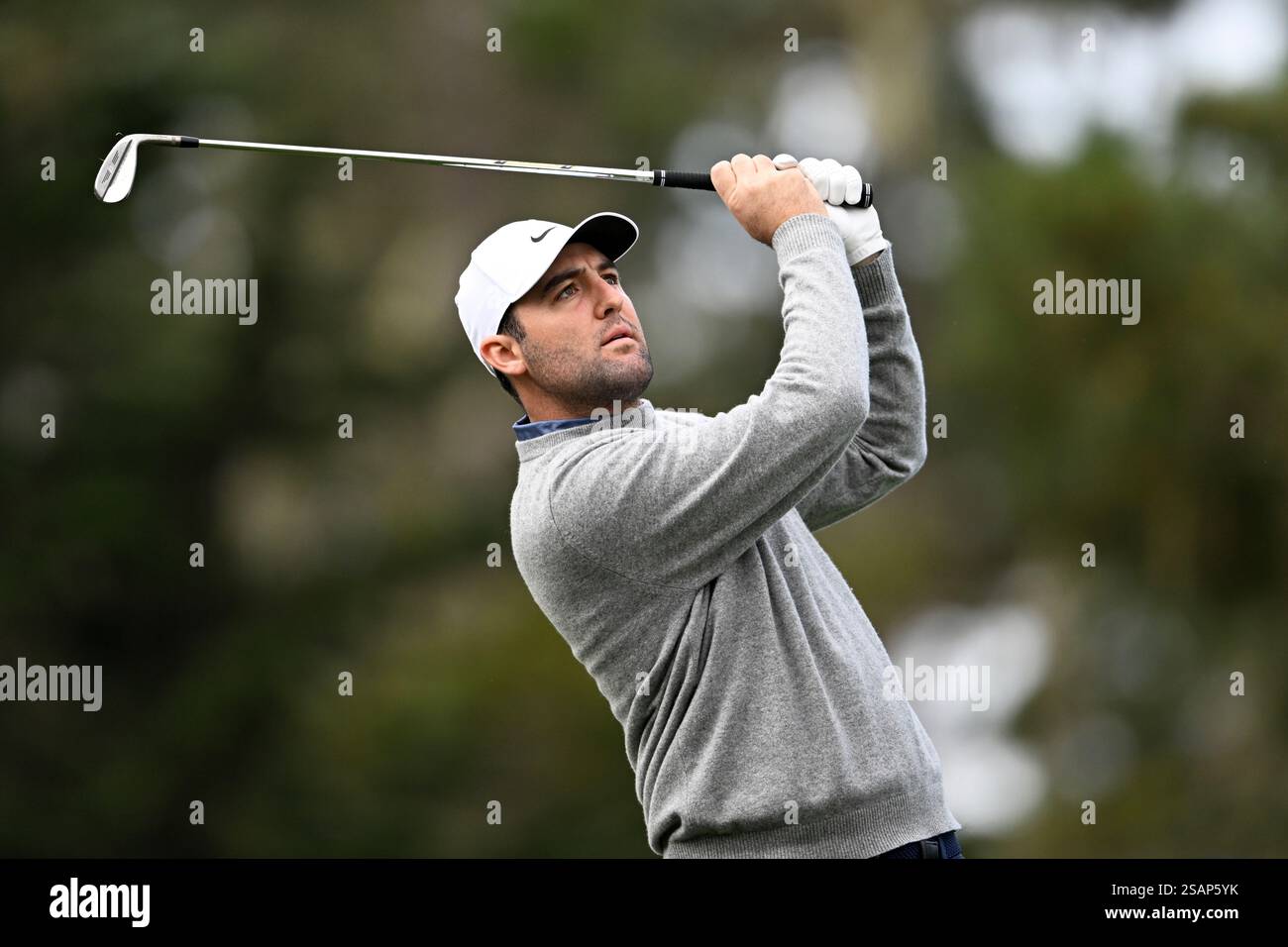 Scottie Scheffler tees off on the 15th hole at Spyglass Hill Golf