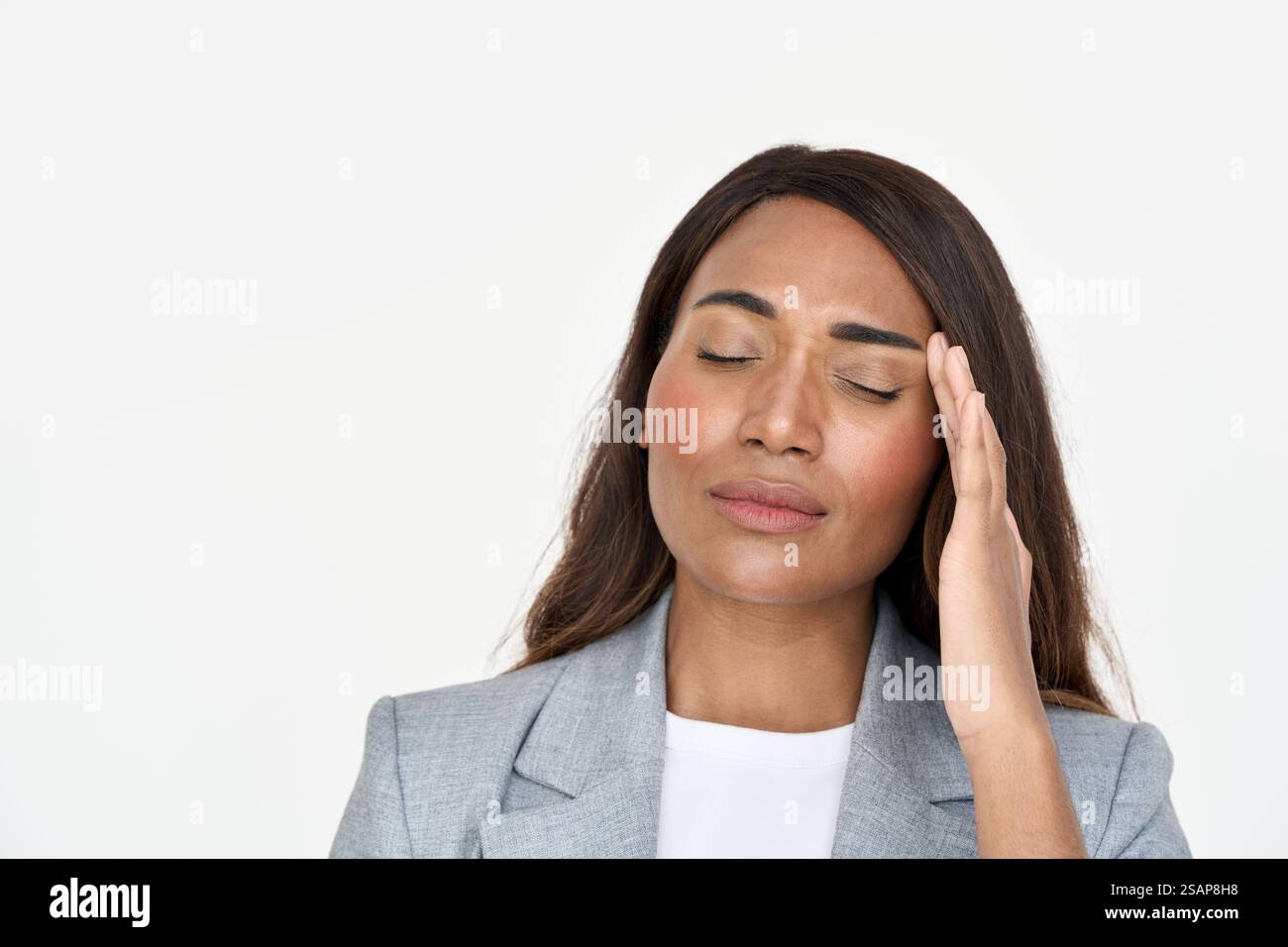 Stressed young African American business woman feeling headache migraine. Stock Photo