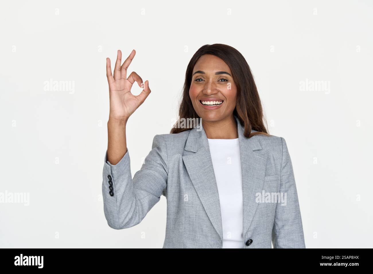 Happy African American business woman showing ok isolated on white. Stock Photo