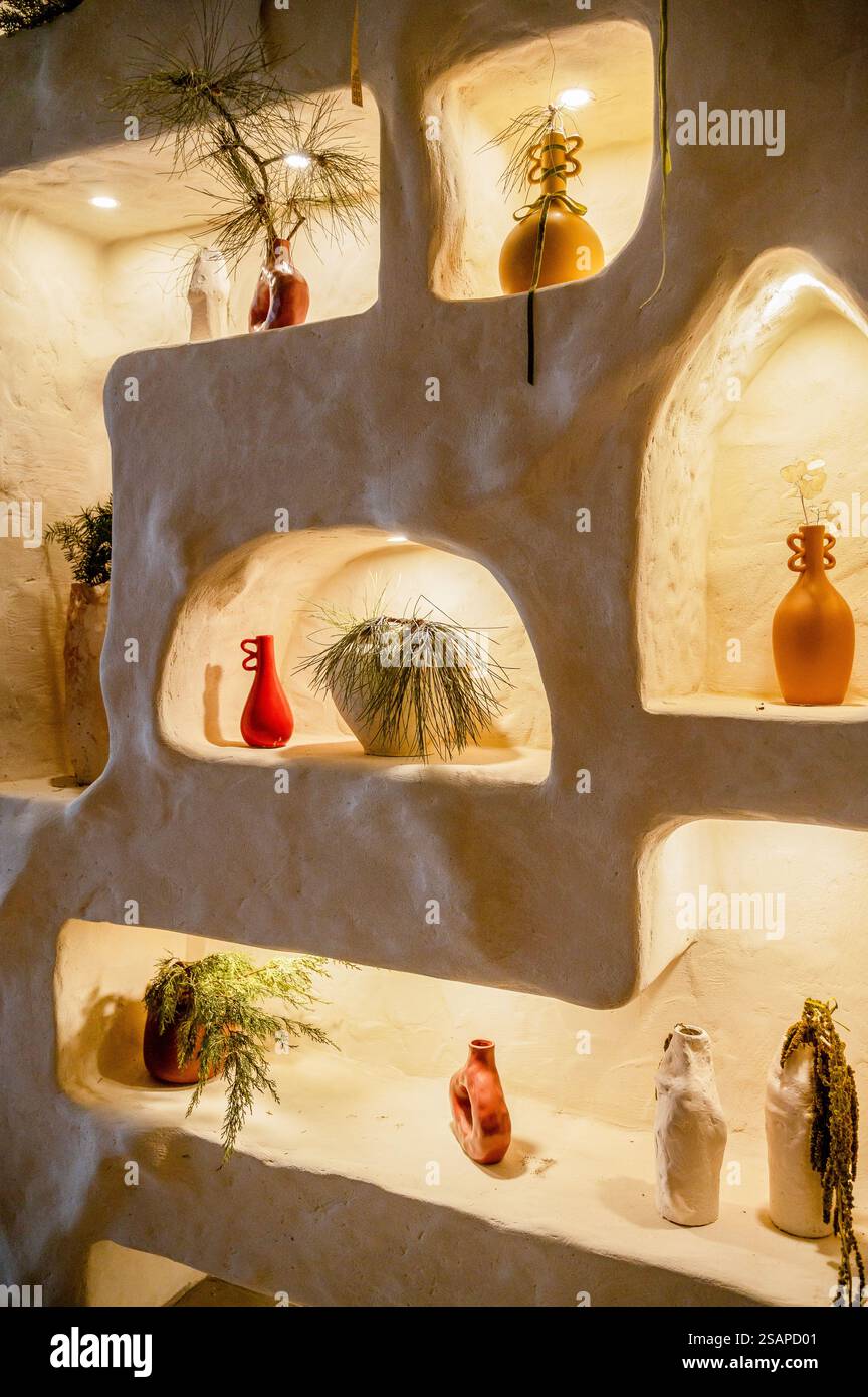 decorative wall with backlight and arches in which vases stand Stock ...