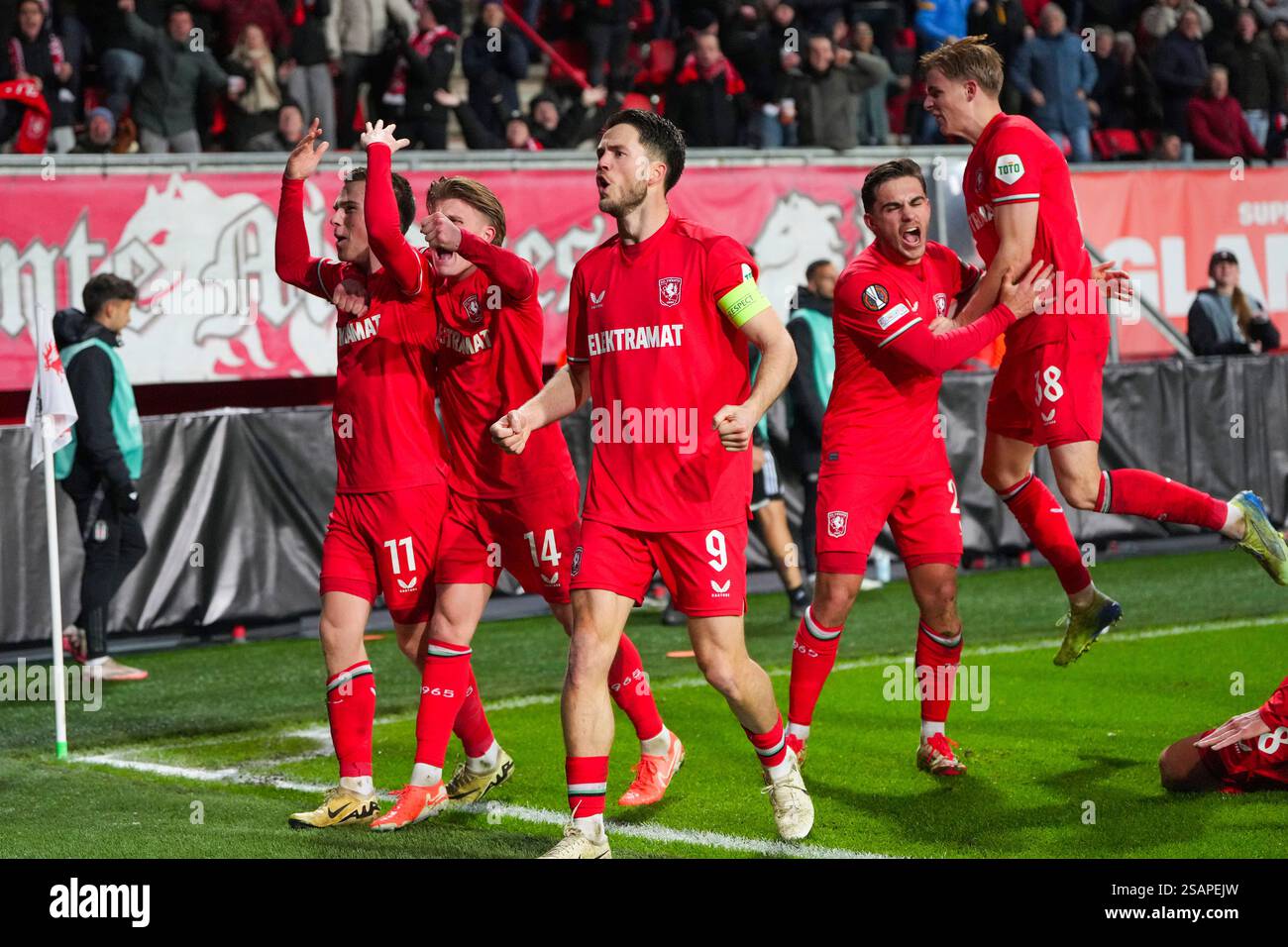 Twente's Daan Rots, left, celebrates with teammates after scoring the ...