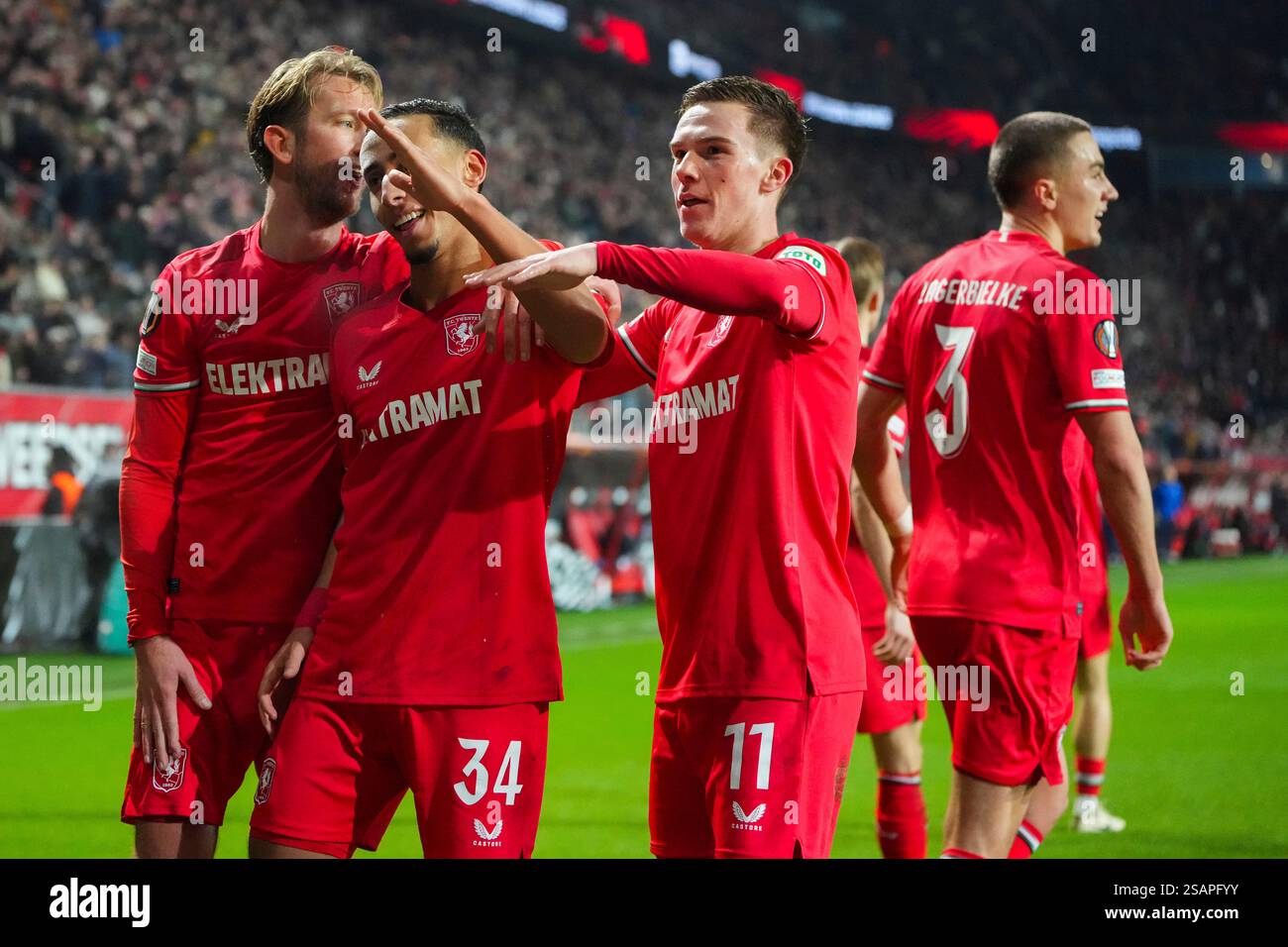 Twente's Daan Rots, right, celebrates with teammates after scoring the ...