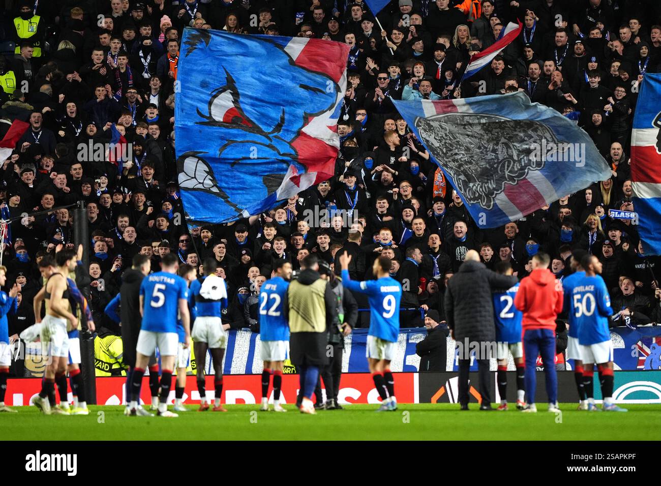 Rangers players applaud the fans after the final whistle in the UEFA
