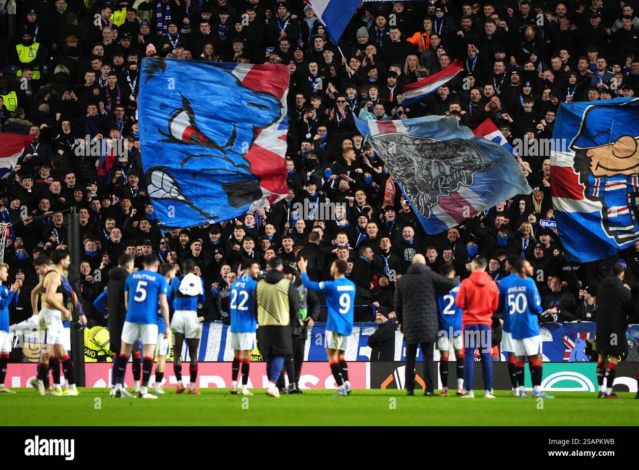 Rangers players applaud the fans after the final whistle in the UEFA