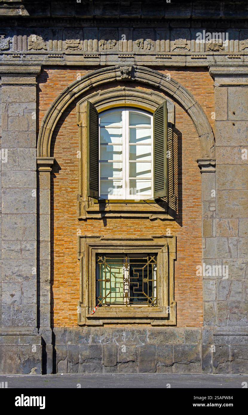 Open window with wooden shades on old building brick wall facade Stock ...