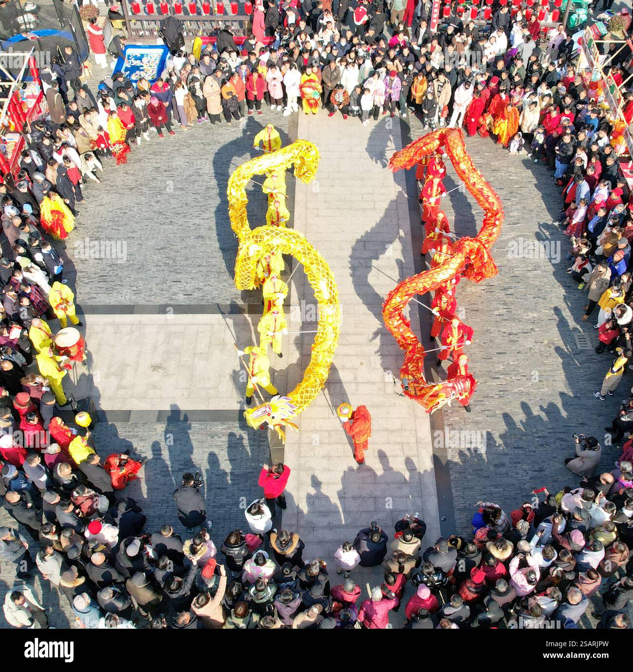 DONGTAI, CHINA JANUARY 30, 2025 Residents watch a dragon dance