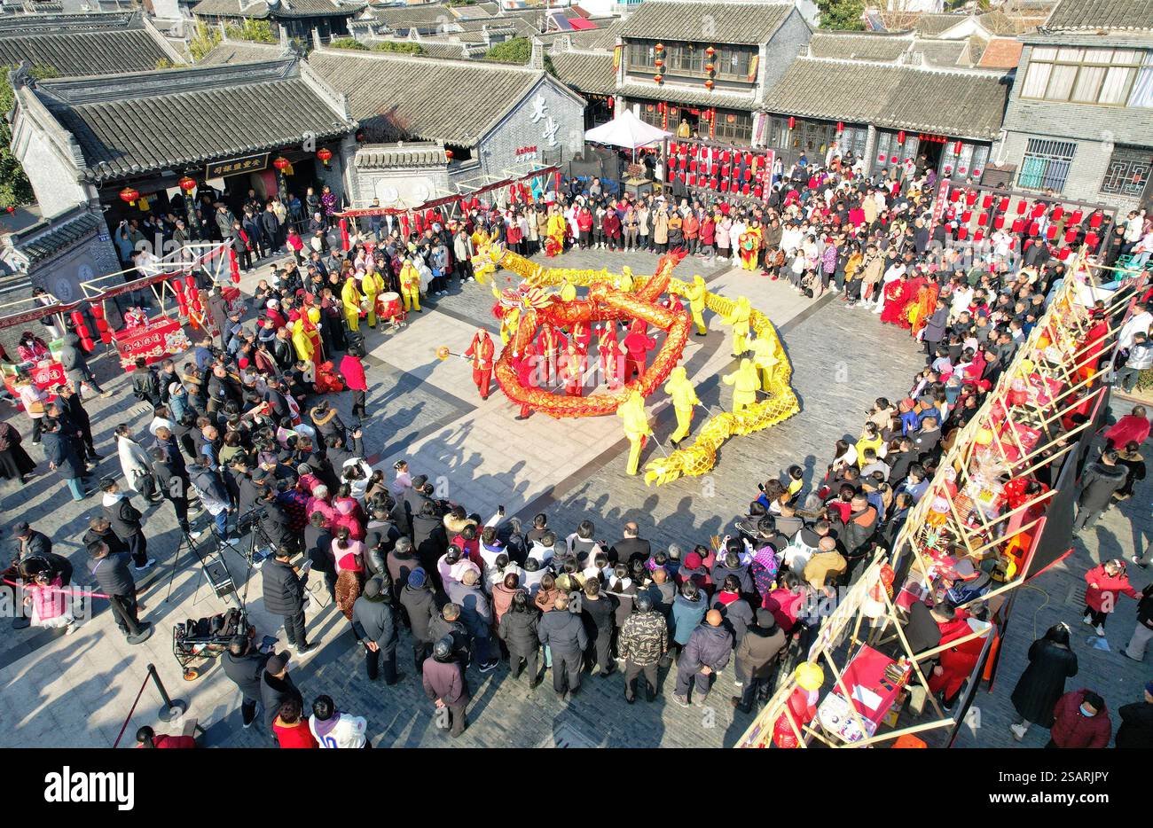 DONGTAI, CHINA JANUARY 30, 2025 Residents watch a dragon dance
