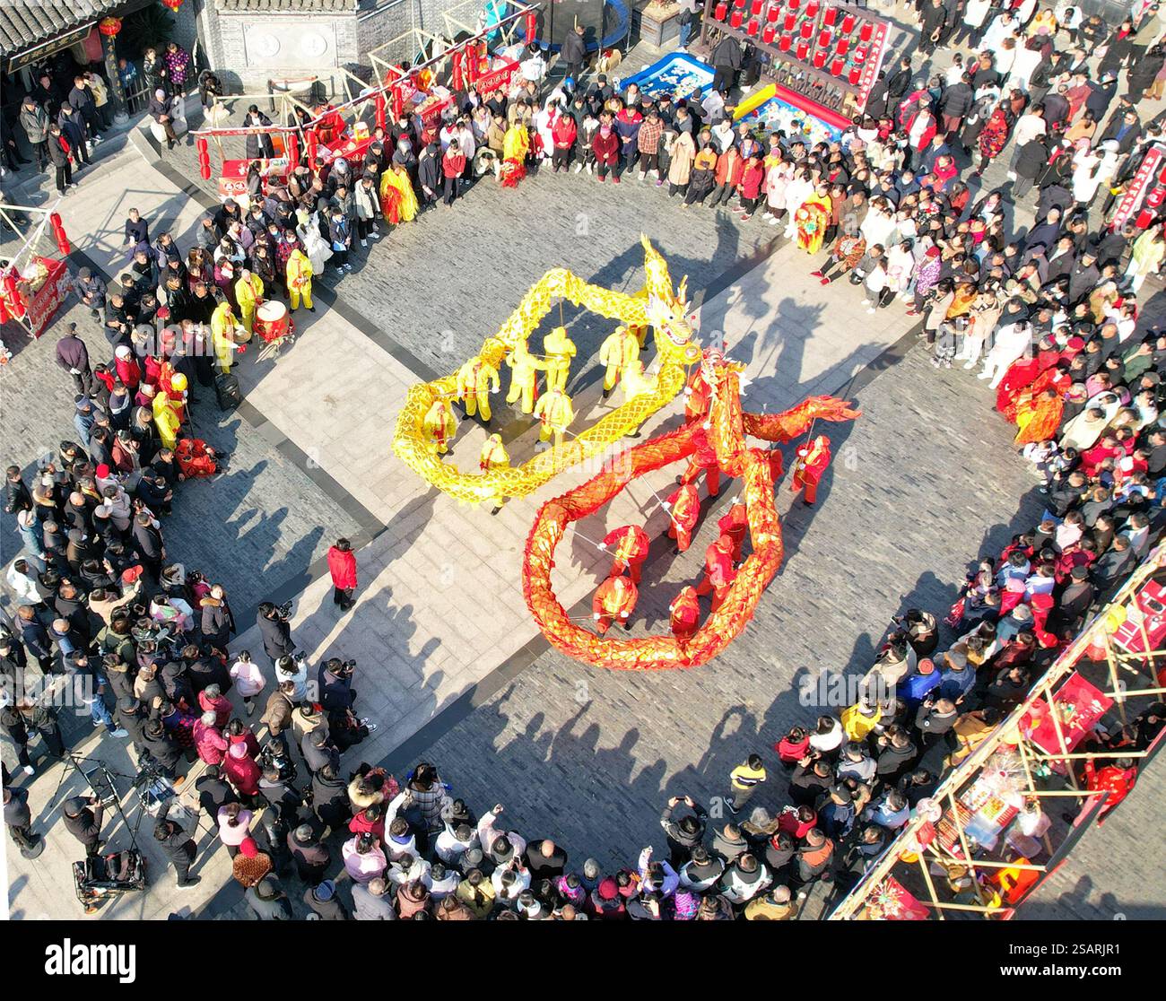 DONGTAI, CHINA JANUARY 30, 2025 Residents watch a dragon dance