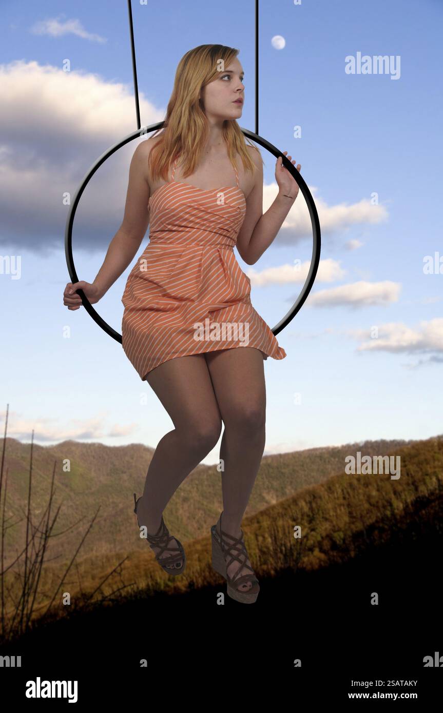 Female flying on swing hi-res stock photography and images - Alamy