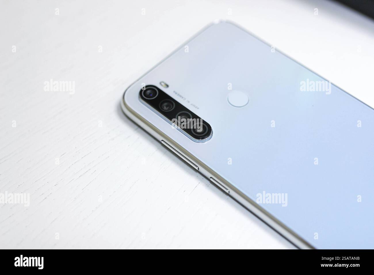 Close-up view of a silver smartphone with quad lenses Stock Photo