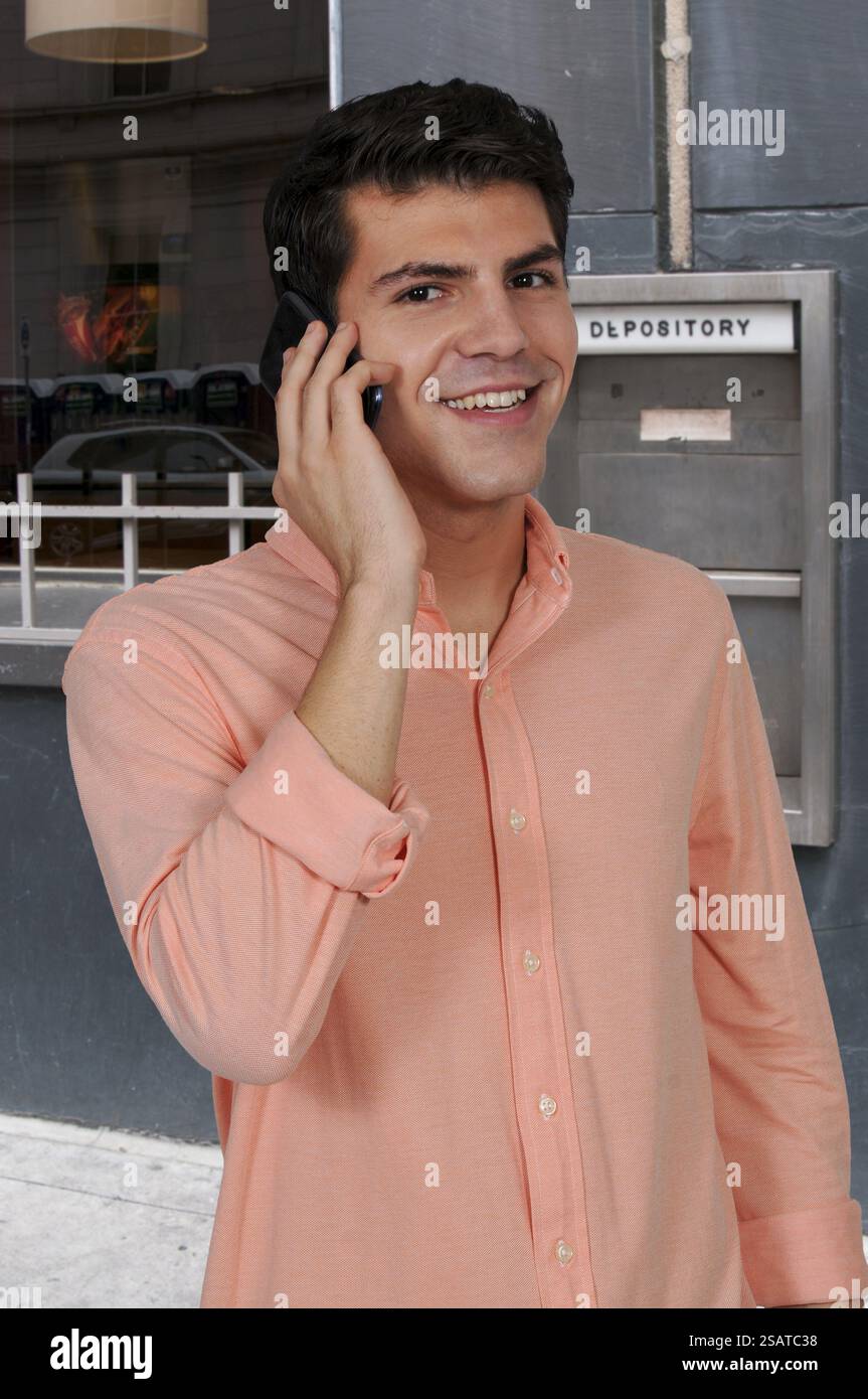 Young man talking on a cell phone Stock Photo