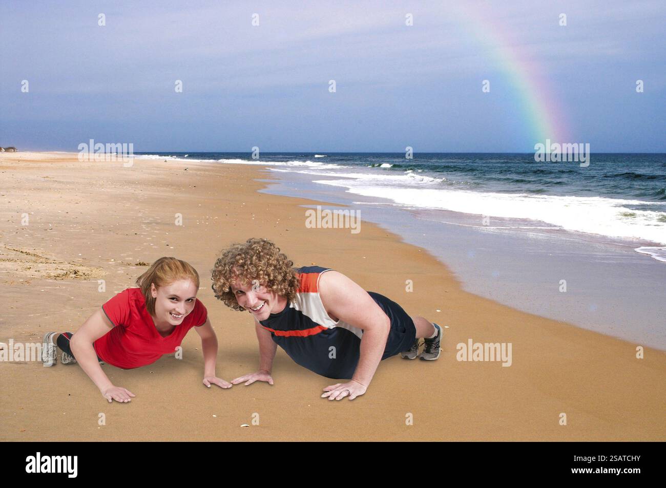 Young couple exercising by doing pushups together Stock Photo