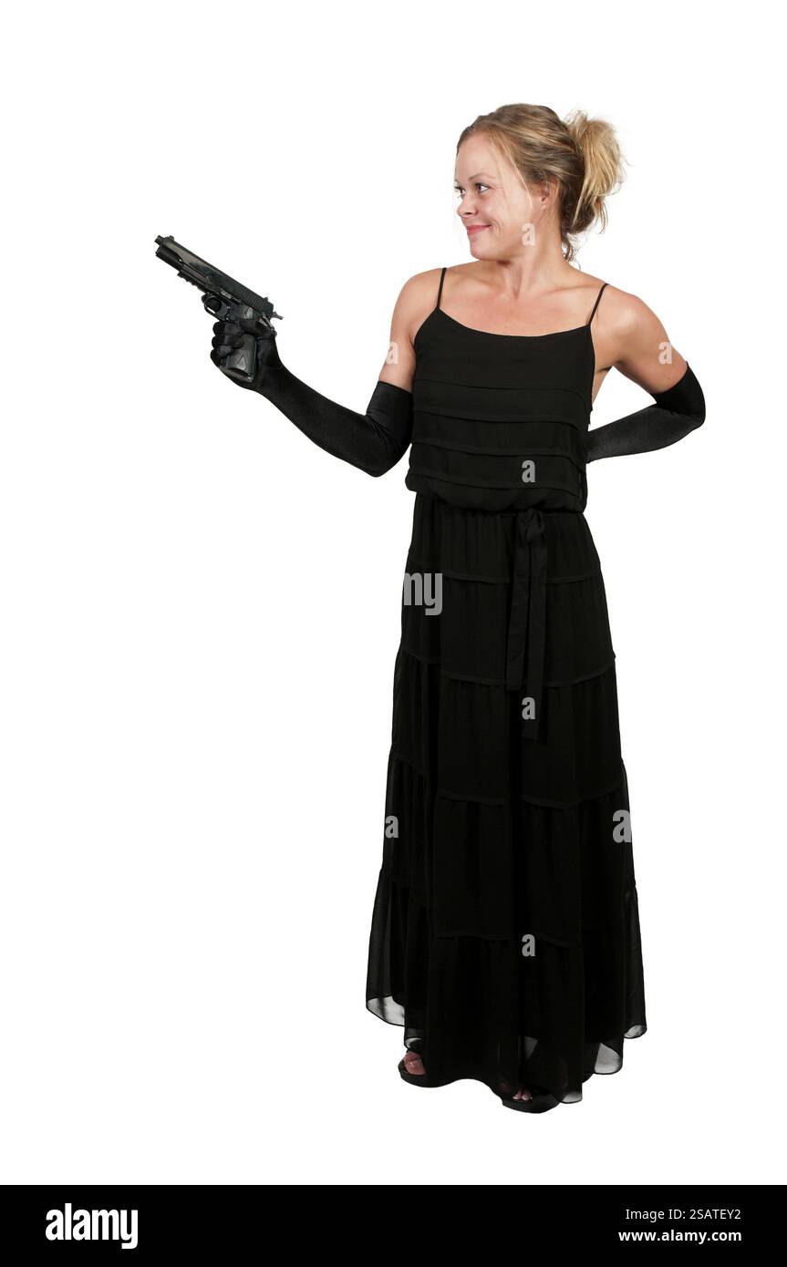 Beautiful young woman criminal with a gun Stock Photo - Alamy