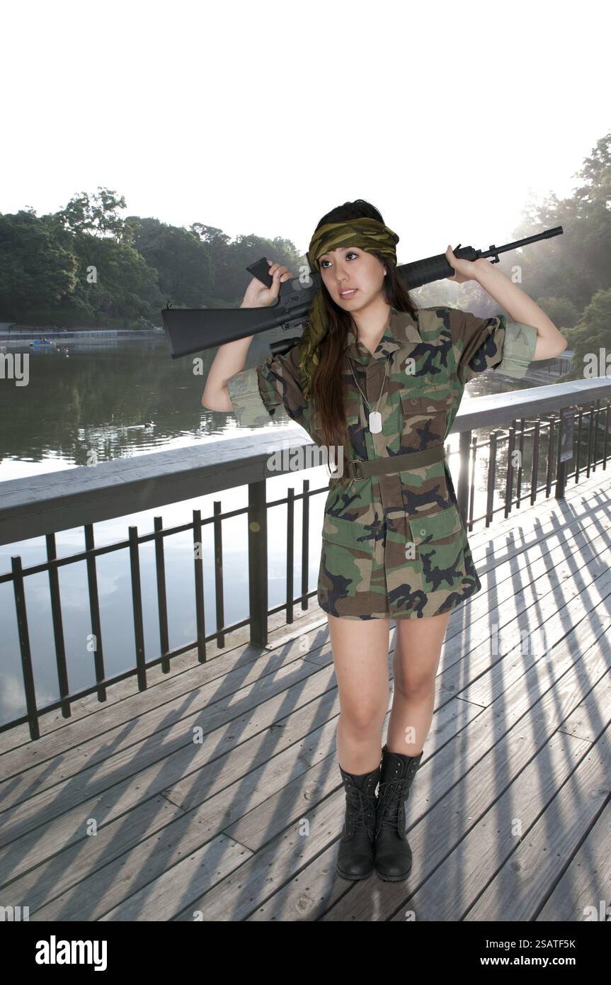 Beautiful young woman soldier with a M16 rifle Stock Photo - Alamy