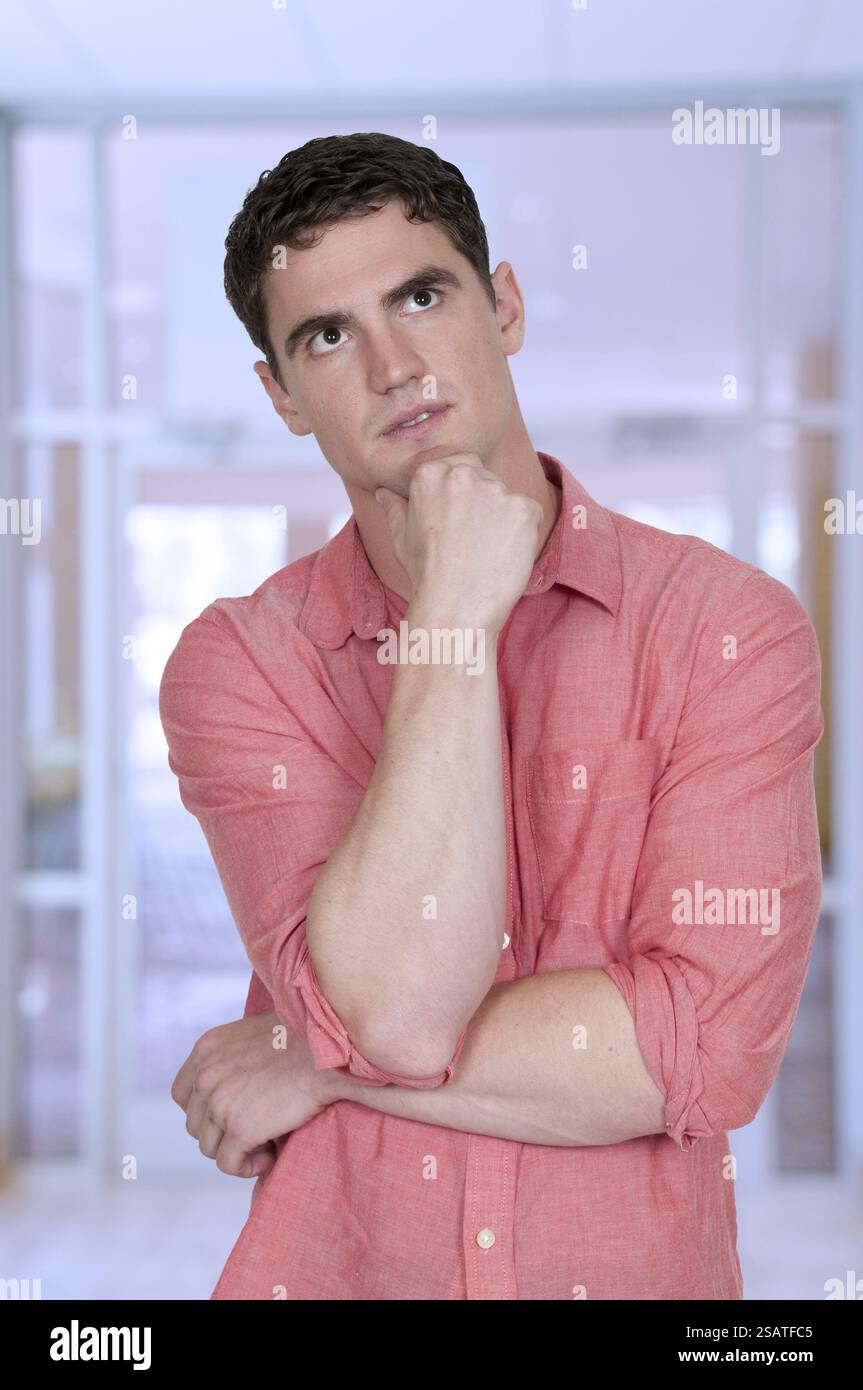 Handsome man thinking thoughts with his brain Stock Photo