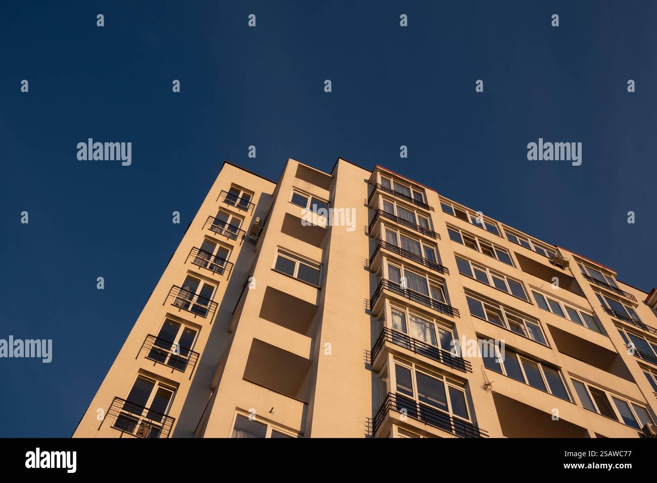 Modern Apartment Building Against Blue Sky Stock Photo - Alamy