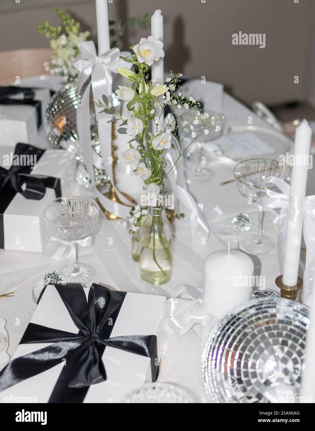 Black and white table setting flowers and candles party Stock Photo - Alamy