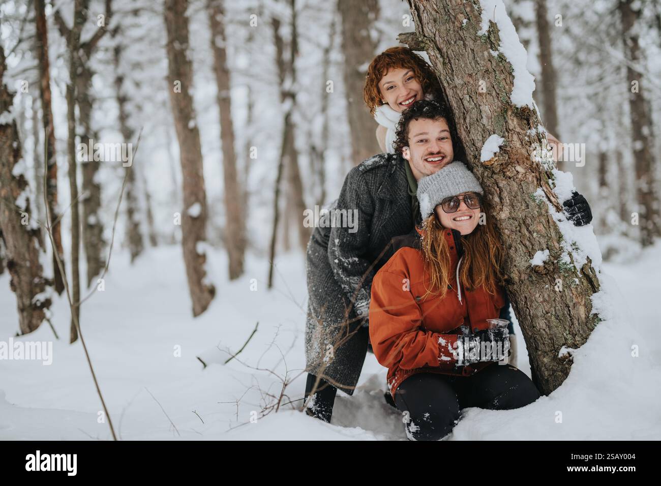 Group friends enjoying snowy forest hi-res stock photography and images ...