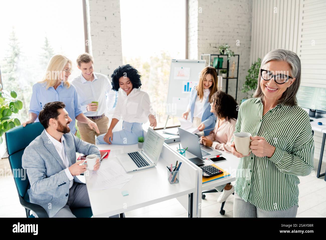 Group of diverse business professionals collaborating in a modern ...