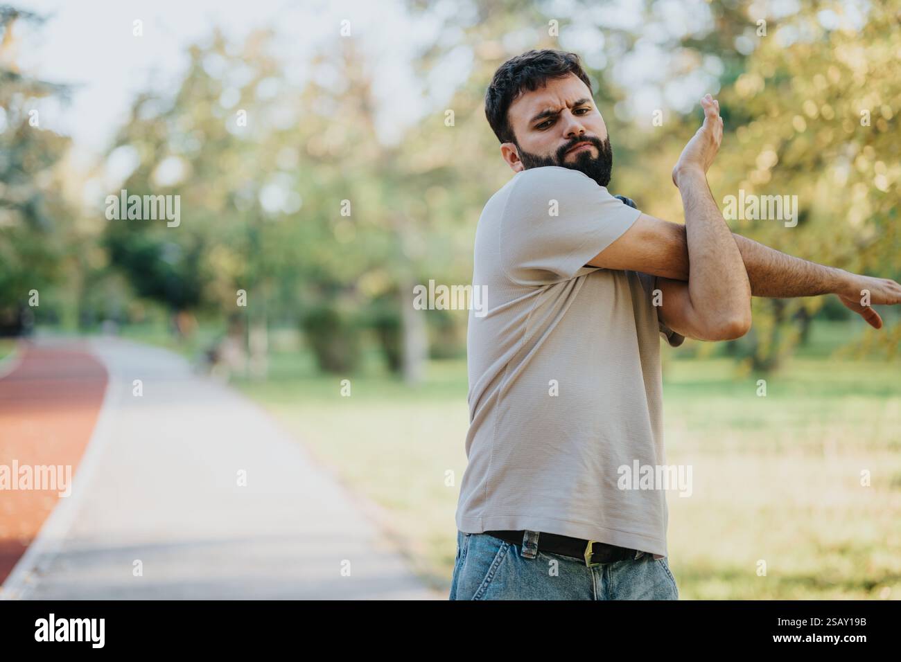 Man track stretching arms hi-res stock photography and images - Alamy