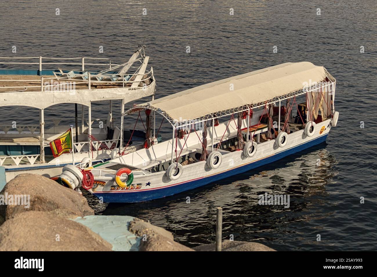 Colorful boat on the Nile river with tourists in Aswan , Egypt Stock ...