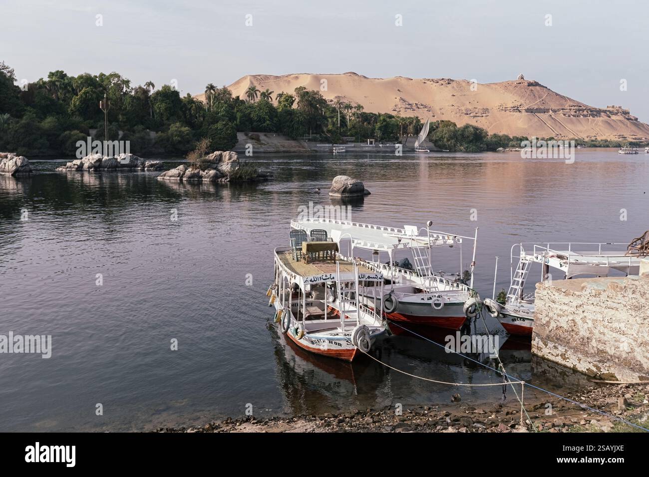Colorful boat on the Nile river with tourists in Aswan , Egypt Stock ...