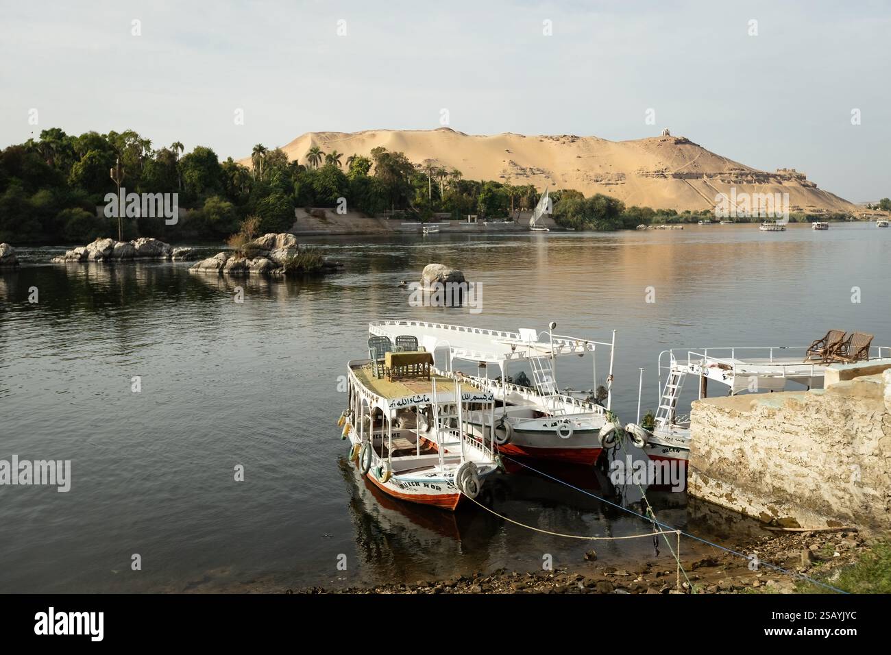 Colorful boat on the Nile river with tourists in Aswan , Egypt Stock ...