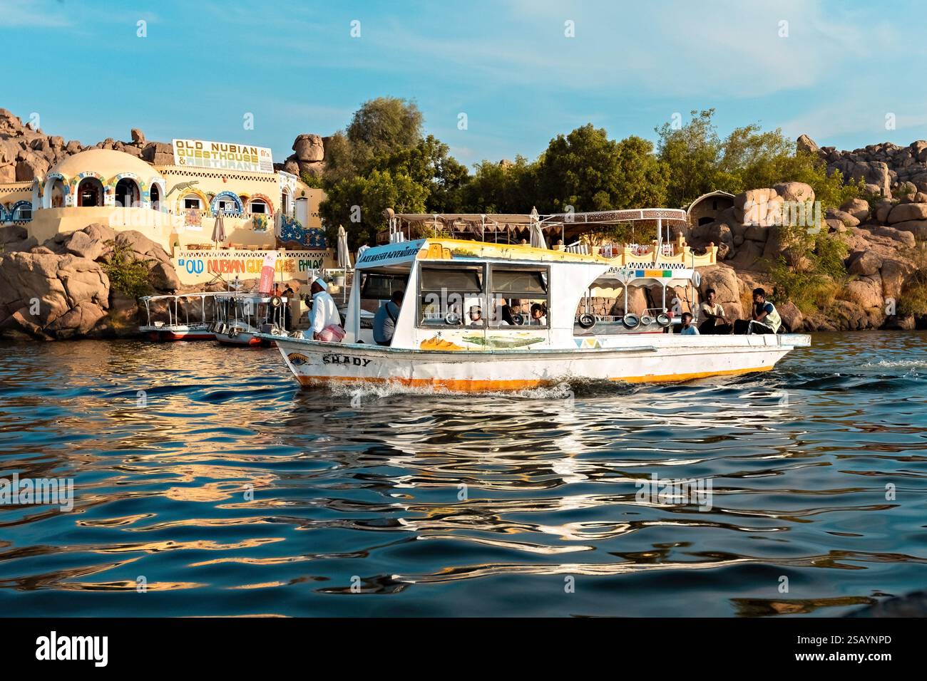 Colorful boat on the Nile river with tourists in Aswan , Egypt Stock ...