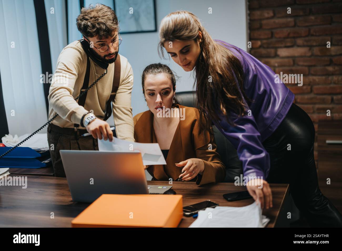 Business team collaborating on a project in a modern office setting ...