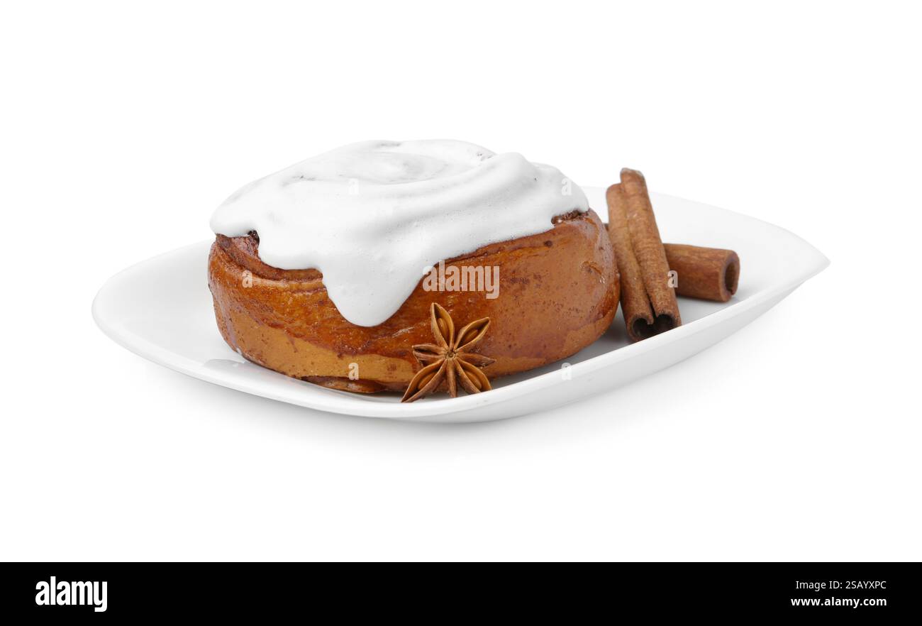 Tasty cinnamon roll with cream and spices isolated on white Stock Photo ...