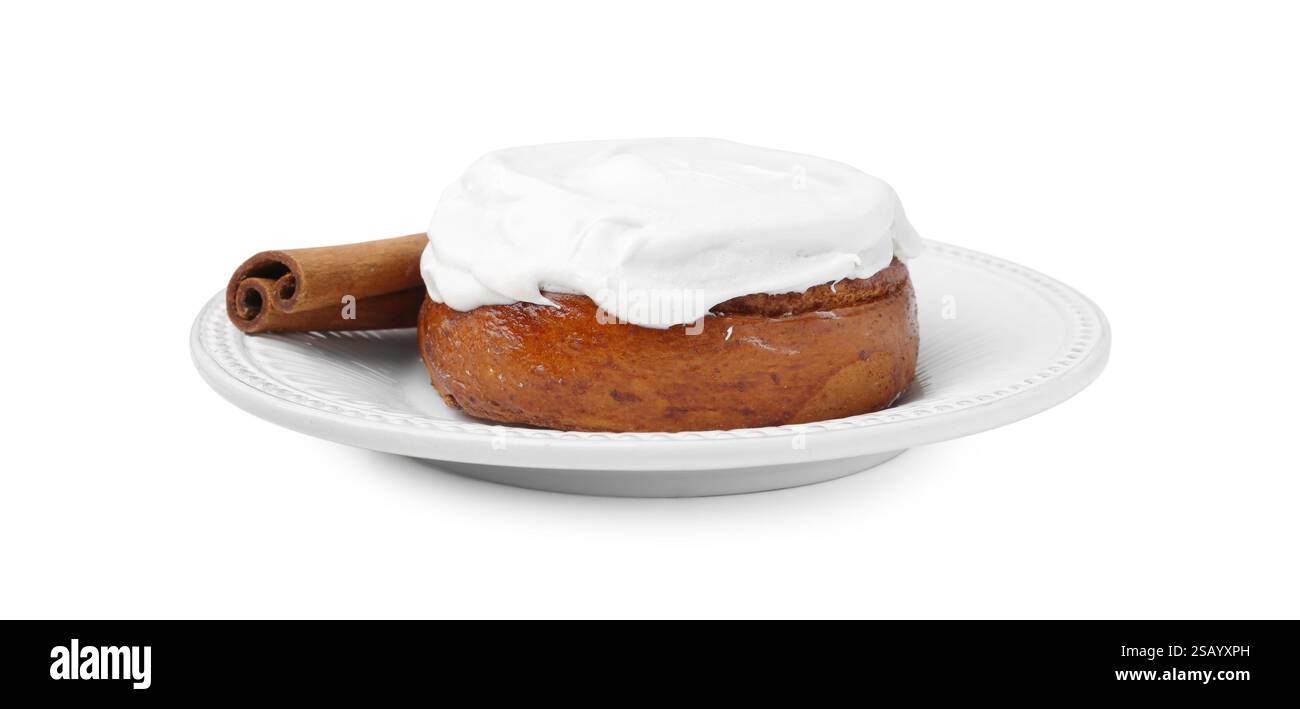 Tasty cinnamon roll with cream and stick isolated on white Stock Photo ...