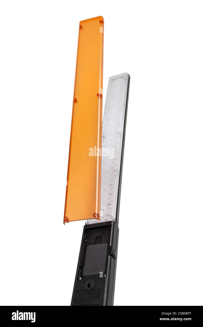 A rectangular LED light panel with a black handle, featuring multiple small LED bulbs covered by a transparent plastic cover, used for photography or Stock Photo