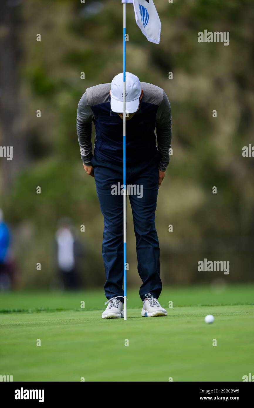 PEBBLE BEACH, CA - JANUARY 30: Jeff Rhodes looks in the hole at Rory ...