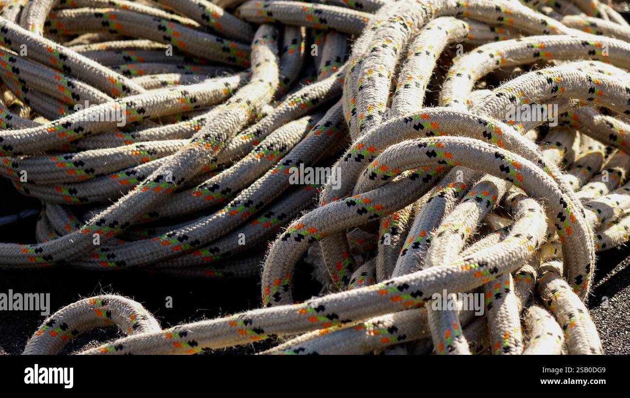 collected rope at the construction site on the black background Stock ...
