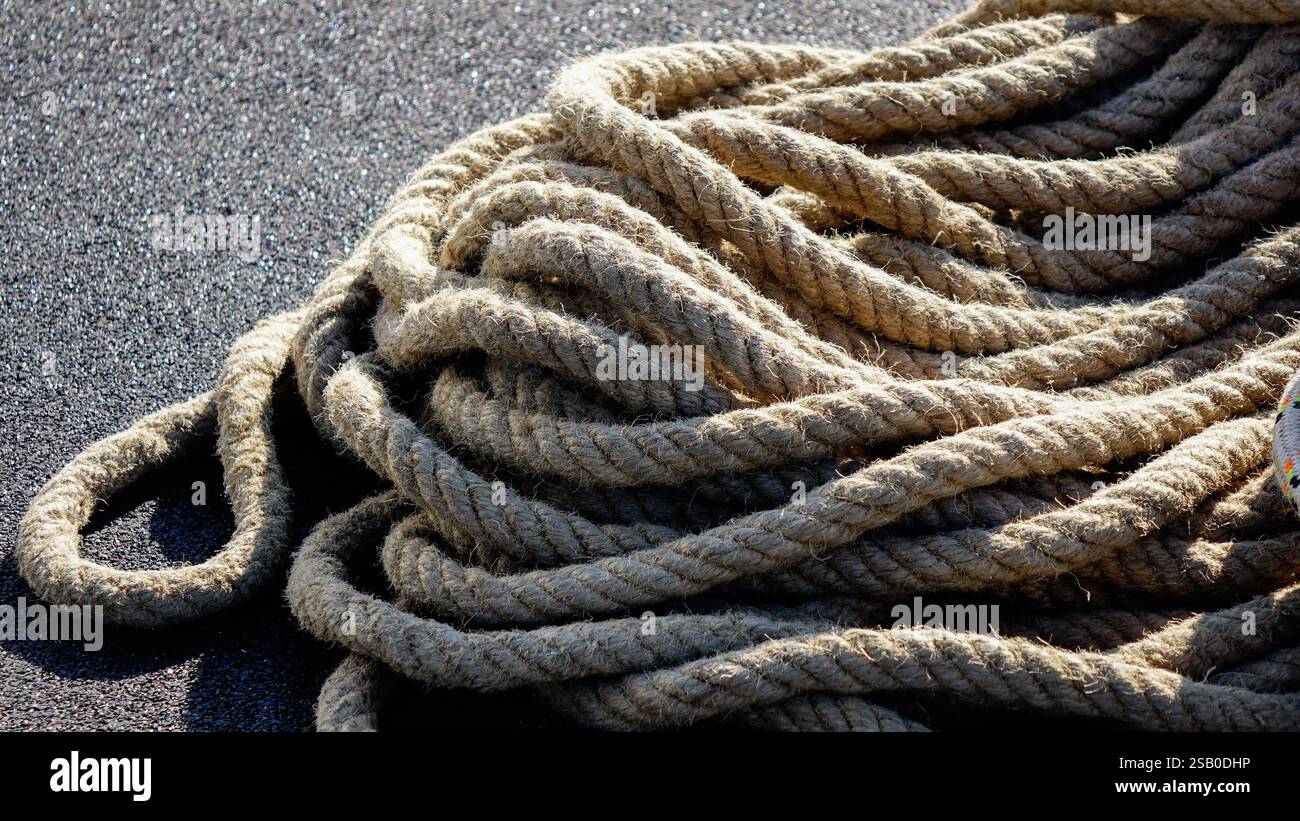 collected rope at the construction site on the black background Stock ...