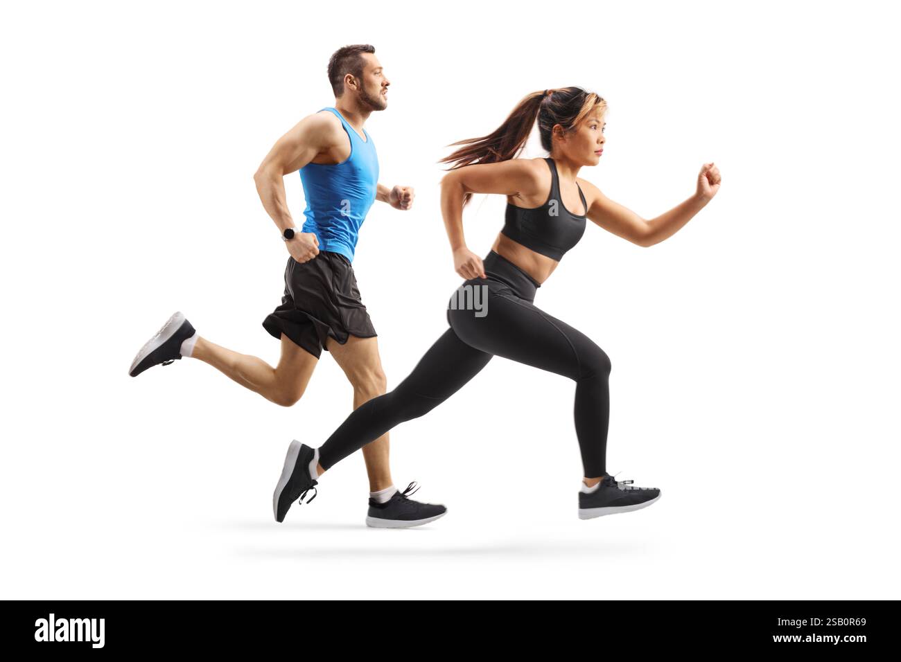 Profile Run Full length profile shot of a group of a man and woman running a race ...